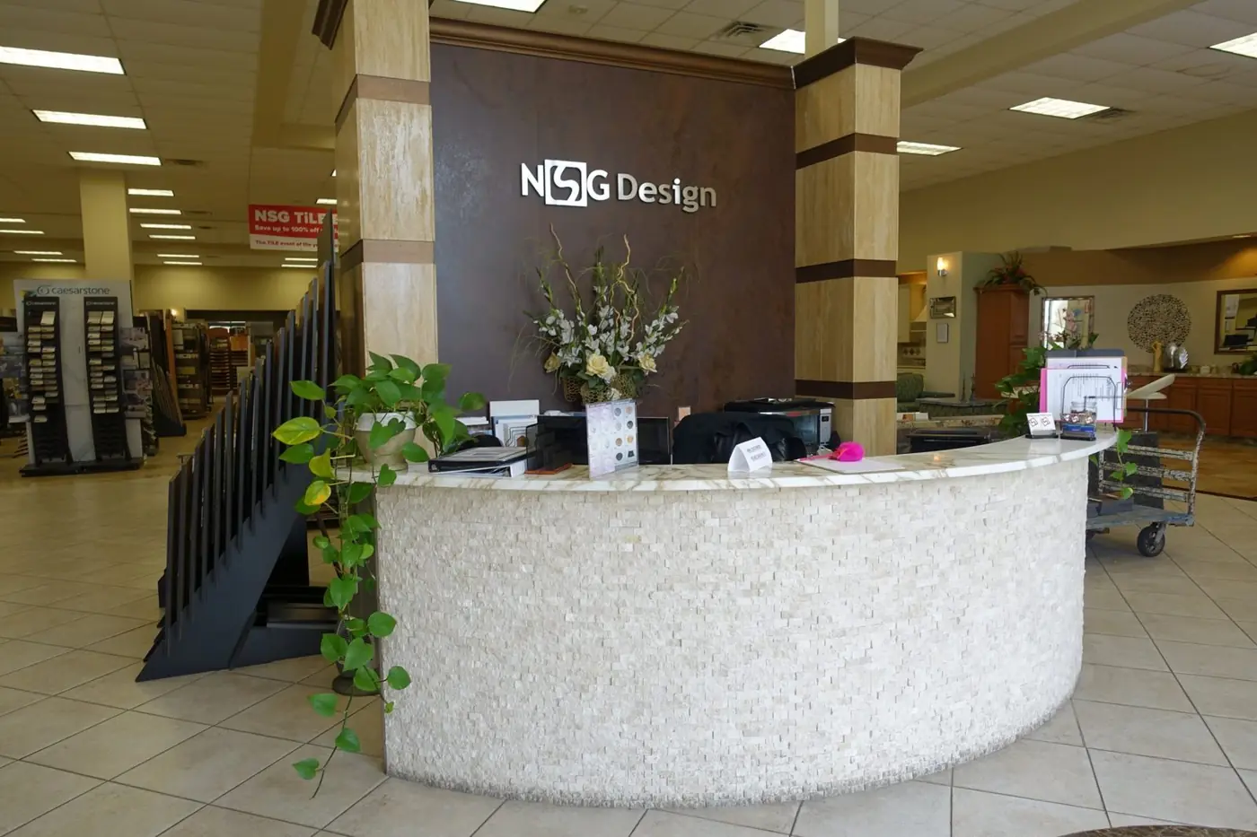 NSG Design showroom front desk with stone-clad counter