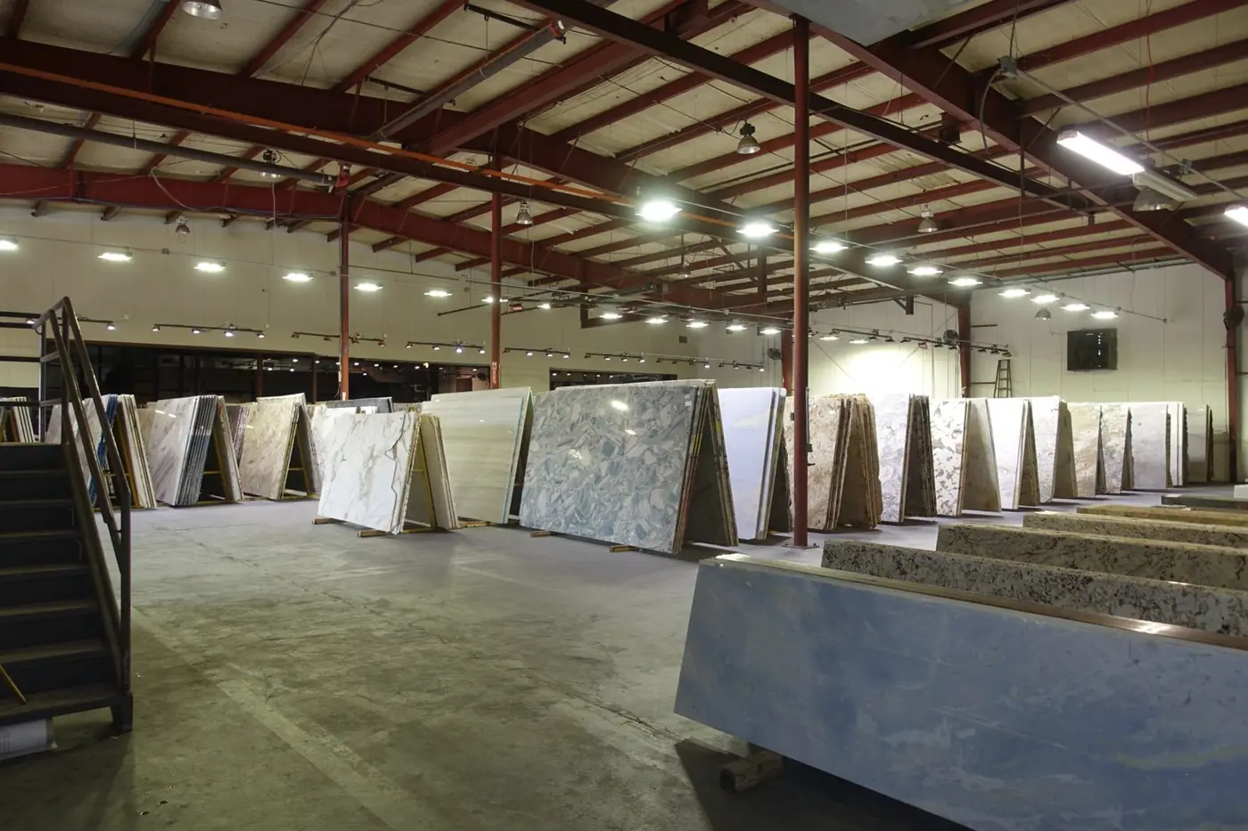 Granite and quartzite slabs on A-frames in the warehouse